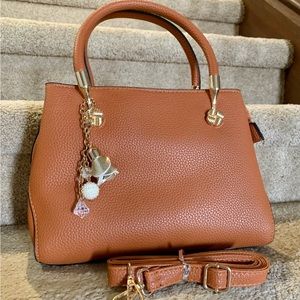 Brown handbag. Purse. Double handle with shoulder strap option.